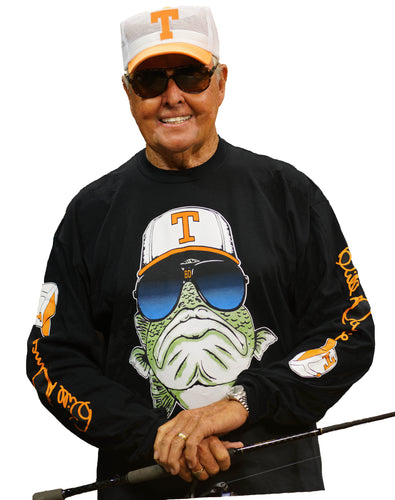Bill Dance wearing the Bill Dance long sleeve logo t-shirt in black and holding a fishing rod while smiling 