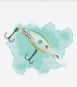 Close up of the “Fat Free Shad Lure” watercolor printed across back of garment